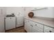 Laundry room featuring a washer, a dryer, white cabinets and laminate countertops at 4907 White Oak Ln, Denver, NC 28037