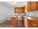 Kitchen features warm wood cabinets, countertops, and floors at 517 S Central Ave, Landis, NC 28088