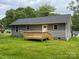 Back exterior of home featuring a small wood deck and vinyl siding at 519 N State St, Lincolnton, NC 28092