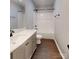 This bathroom features a shower over tub and a vanity with modern fixtures at 519 N State St, Lincolnton, NC 28092