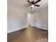 This well-lit bedroom features hardwood floors, a large closet, and access to another room at 519 N State St, Lincolnton, NC 28092