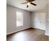 This bedroom features laminate floors and a window at 519 N State St, Lincolnton, NC 28092