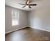 This bedroom features laminate floors, a ceiling fan and a window at 519 N State St, Lincolnton, NC 28092