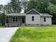 Charming single-story home with a covered front porch and well-maintained lawn at 519 N State St, Lincolnton, NC 28092