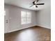 Well-lit living area featuring durable laminate floors, and natural light at 519 N State St, Lincolnton, NC 28092