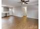 Open-concept living area featuring laminate floors, and seamless flow to other rooms at 519 N State St, Lincolnton, NC 28092