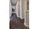 Inviting hallway with gleaming dark hardwood floors and elegant white trim at 546 Amalfi Dr, Davidson, NC 28036