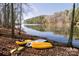 Sunny lakeside with bright yellow kayaks, ready for a peaceful water adventure at 546 Amalfi Dr, Davidson, NC 28036