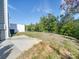 Backyard showcasing a concrete patio and green space with a white privacy fence at 574 Altamonte Dr, Clover, SC 29710