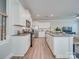 Modern kitchen featuring stainless steel appliances, white cabinetry, and an island with seating at 574 Altamonte Dr, Clover, SC 29710