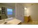 Bright bathroom with a soaking tub and a large mirror at 5834 Coopers Ridge Ln, Charlotte, NC 28269