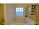 This bathroom is equipped with a soaking tub and a walk-in shower at 5834 Coopers Ridge Ln, Charlotte, NC 28269