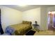 Bedroom featuring neutral carpeting, a small table, and a bed at 5834 Coopers Ridge Ln, Charlotte, NC 28269