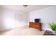 Bedroom featuring neutral carpeting, closet, and wooden dresser at 5834 Coopers Ridge Ln, Charlotte, NC 28269