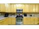 Kitchen features stainless steel appliances and light-colored cabinets at 5834 Coopers Ridge Ln, Charlotte, NC 28269