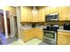 Kitchen features stainless steel appliances and light-colored cabinets at 5834 Coopers Ridge Ln, Charlotte, NC 28269