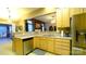 Kitchen featuring stainless steel appliances and a view of the living room at 5834 Coopers Ridge Ln, Charlotte, NC 28269