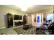 Open concept living room with a fireplace and view of the dining room at 5834 Coopers Ridge Ln, Charlotte, NC 28269