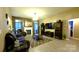 Cozy living room with fireplace, large windows, and wood floors at 5834 Coopers Ridge Ln, Charlotte, NC 28269