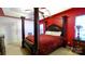 Spacious main bedroom features a four-poster bed and neutral carpeting at 5834 Coopers Ridge Ln, Charlotte, NC 28269