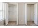 Three closets, offering ample storage solutions with shelving, and white doors at 6212 Windsor Gate Ln, Charlotte, NC 28215