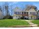 Charming two-story townhome with a well-manicured lawn and inviting front porch at 6212 Windsor Gate Ln, Charlotte, NC 28215