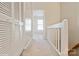 Well lit hallway with carpeted floor and ample closet space at 6212 Windsor Gate Ln, Charlotte, NC 28215