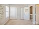 Neutral room with multiple closets, windows, and white door at 6212 Windsor Gate Ln, Charlotte, NC 28215