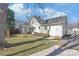 View of backyard featuring grass, patio, and exterior of the house at 6626 Somersworth Dr, Charlotte, NC 28215