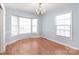 Bright dining area featuring a chandelier and large windows offering plenty of natural light at 6626 Somersworth Dr, Charlotte, NC 28215