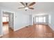 Open-concept living area with hardwood floors, neutral walls, and ample natural light at 6626 Somersworth Dr, Charlotte, NC 28215