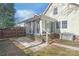 Backyard view featuring a screened porch attached to the home, perfect for enjoying the outdoors at 6626 Somersworth Dr, Charlotte, NC 28215