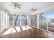 Bright sunroom with hardwood floors and sliding glass doors leading to the yard at 6626 Somersworth Dr, Charlotte, NC 28215