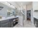 Bright bathroom featuring a large shower with glass door and a modern double vanity with ample storage at 7034 Pin Oaks Dr, Denver, NC 28037