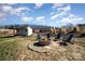 Inviting fire pit area with Adirondack chairs, perfect for outdoor entertaining at 7034 Pin Oaks Dr, Denver, NC 28037