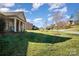 Well-manicured front yard showcasing a lush green lawn and inviting curb appeal at 7034 Pin Oaks Dr, Denver, NC 28037