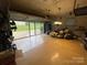 View of an oversized two-car garage with epoxy floor, storage, and lots of natural light at 7034 Pin Oaks Dr, Denver, NC 28037
