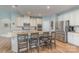 Spacious kitchen features stainless appliances, granite countertops, and a large center island with seating at 7034 Pin Oaks Dr, Denver, NC 28037