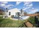 Backyard view featuring a refreshing in-ground pool and comfortable lounge area at 7034 Pin Oaks Dr, Denver, NC 28037