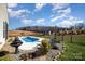 Backyard featuring a freeform pool, small fountain, white deck and adjacent iron fencing at 7034 Pin Oaks Dr, Denver, NC 28037