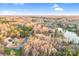 Aerial view of neighborhood showing a home near a lake and wooded areas at 8005 Bridger Pt, Waxhaw, NC 28173