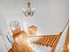 Entryway featuring hardwood floors, a chandelier, a wooden staircase, and a decorative glass door at 8005 Bridger Pt, Waxhaw, NC 28173