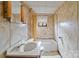 Cozy bathroom featuring a tub/shower combination and distinct vintage wallpaper at 825 Rock Grove Church Rd, Salisbury, NC 28146