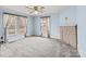 Light blue bedroom with ample natural light, ceiling fan and decorative fireplace at 825 Rock Grove Church Rd, Salisbury, NC 28146