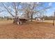 View of back yard and out buildings with house in the background at 825 Rock Grove Church Rd, Salisbury, NC 28146