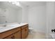 Bathroom with dual sinks, wood cabinets, and tile flooring at 9508 Coast Laurel Nw Ave, Concord, NC 28027