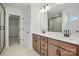 Bathroom with double sink vanity, large mirror, and tiled shower at 9508 Coast Laurel Nw Ave, Concord, NC 28027