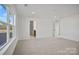 Spacious bedroom with neutral carpet and bright window at 9508 Coast Laurel Nw Ave, Concord, NC 28027