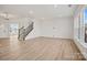 A spacious living room featuring hardwood floors and an abundance of natural light at 9508 Coast Laurel Nw Ave, Concord, NC 28027