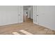 A room with light hardwood floors and french doors at 9508 Coast Laurel Nw Ave, Concord, NC 28027